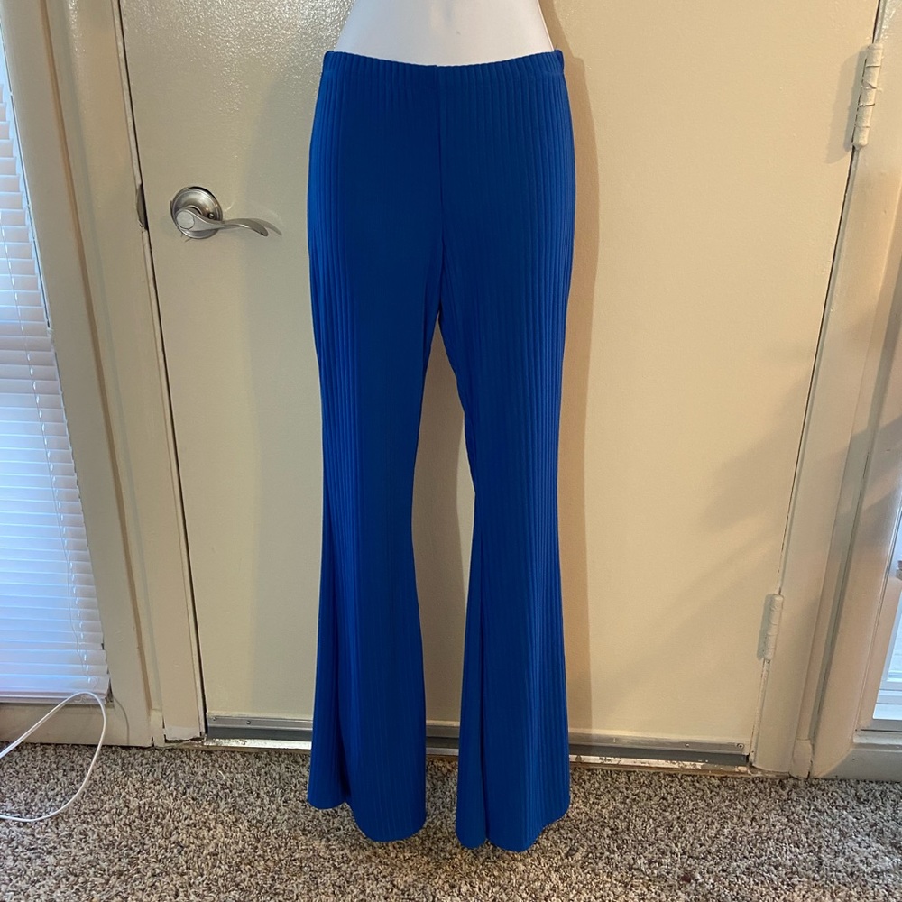 Blue high waisted stretch pants with cinched butt.